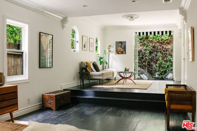 a sitting area with furniture and a window