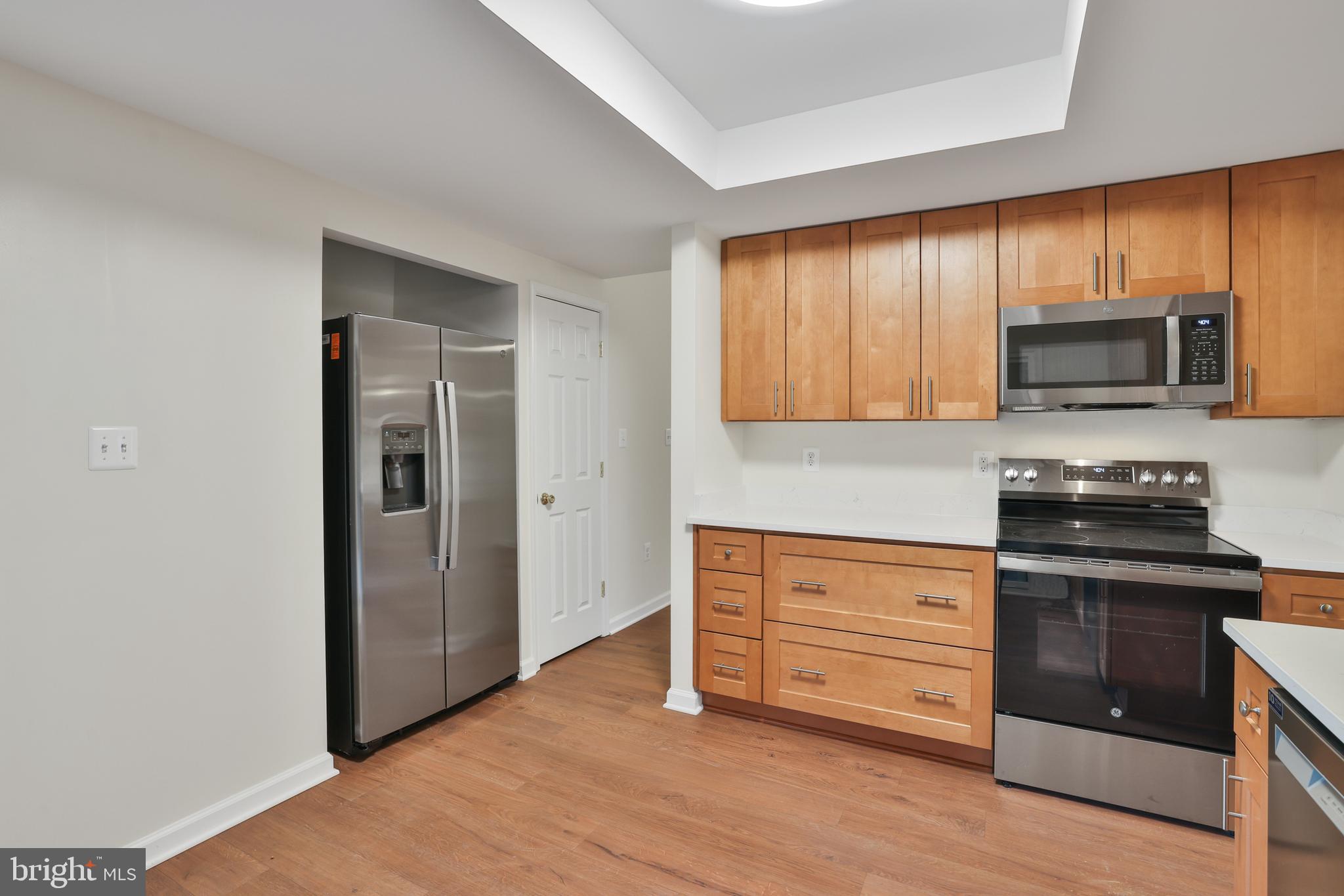 36 Thrush Road Sterling, VA 20164 - Photo 17 of 35 a kitchen with wooden cabinets and stainless steel appliances