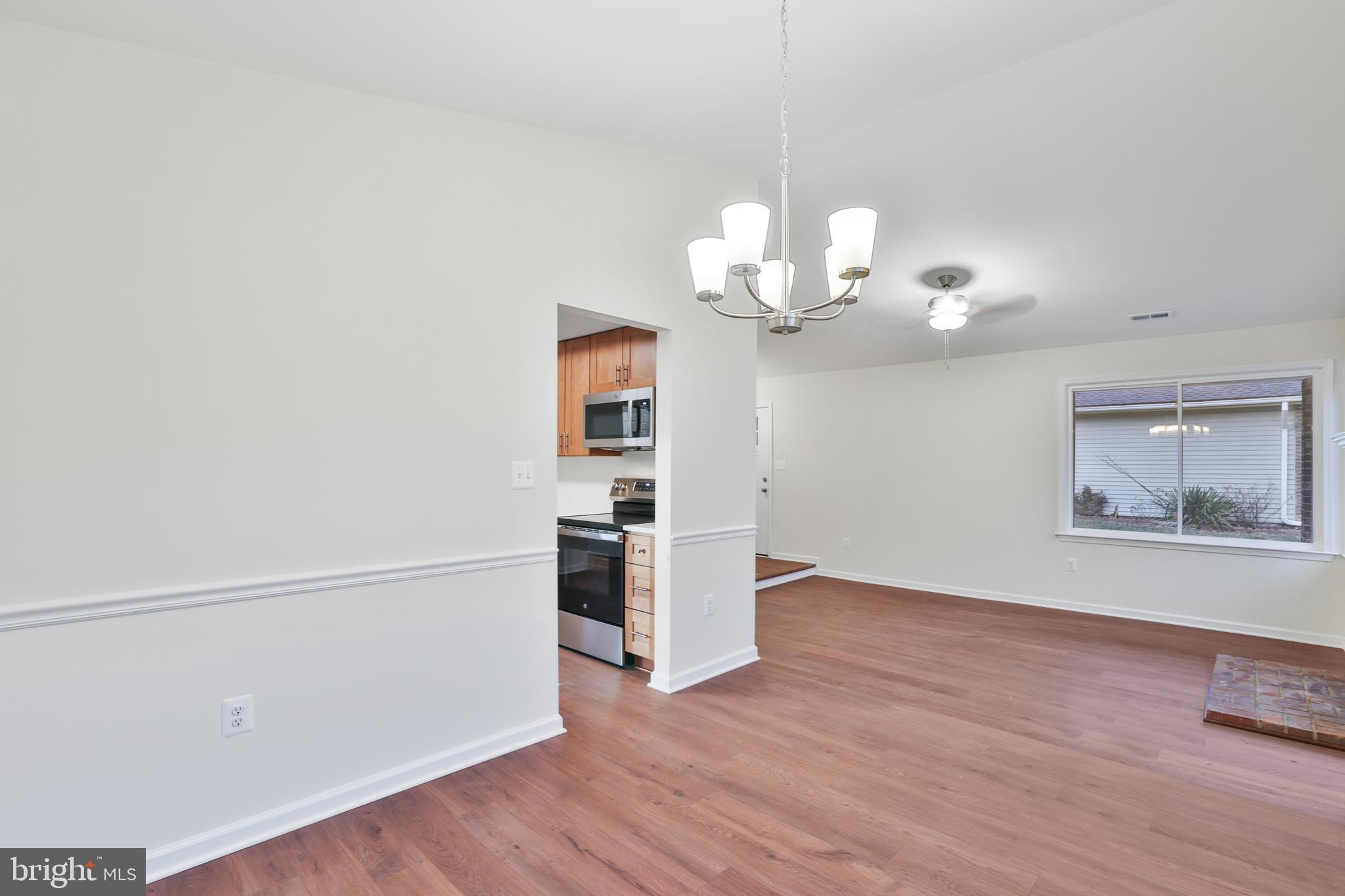 36 Thrush Road Sterling, VA 20164 - Photo 20 of 35 wooden floor in an empty room with a window