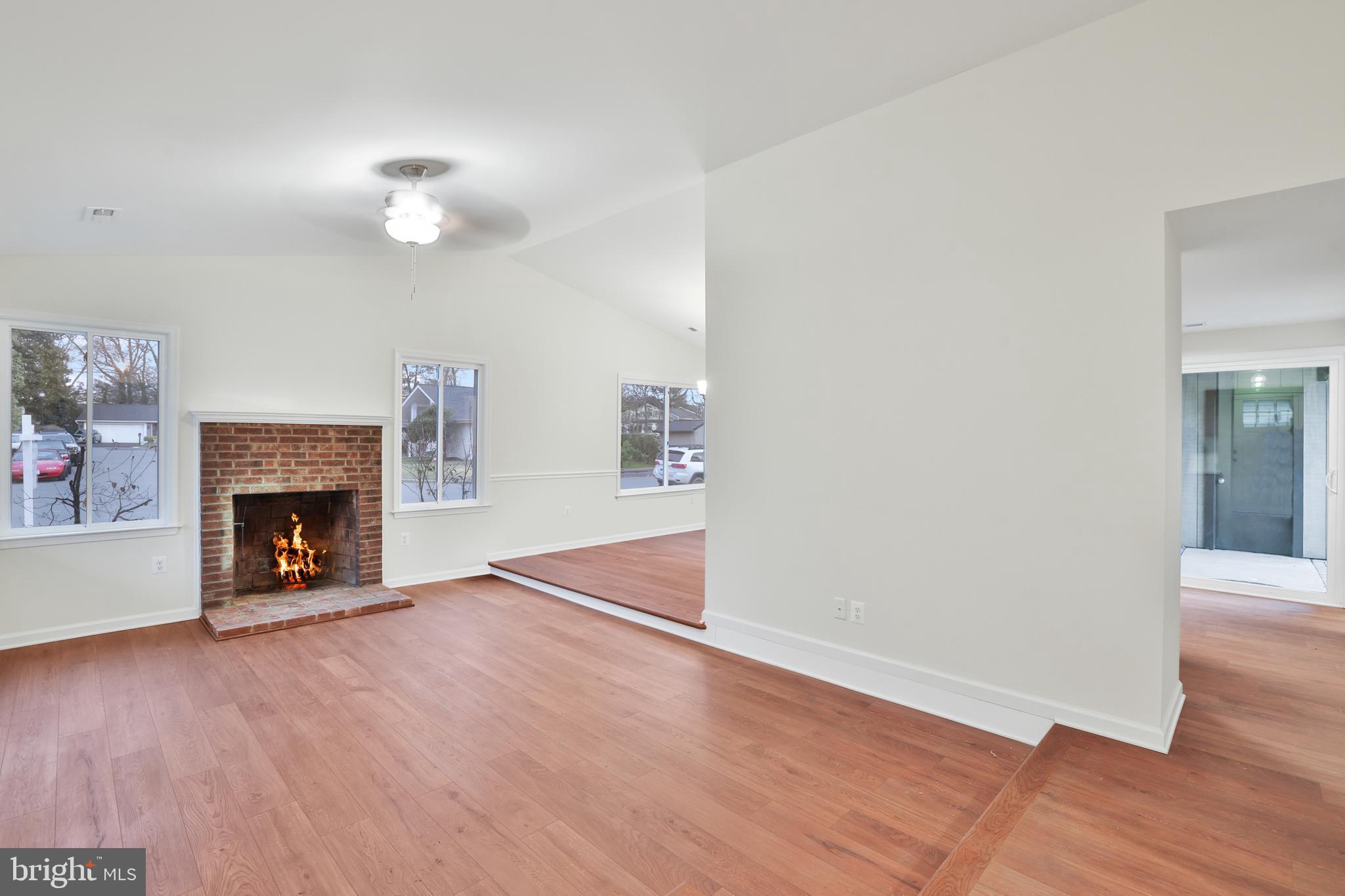36 Thrush Road Sterling, VA 20164 - Photo 24 of 35 an empty room with wooden floor fireplace and window