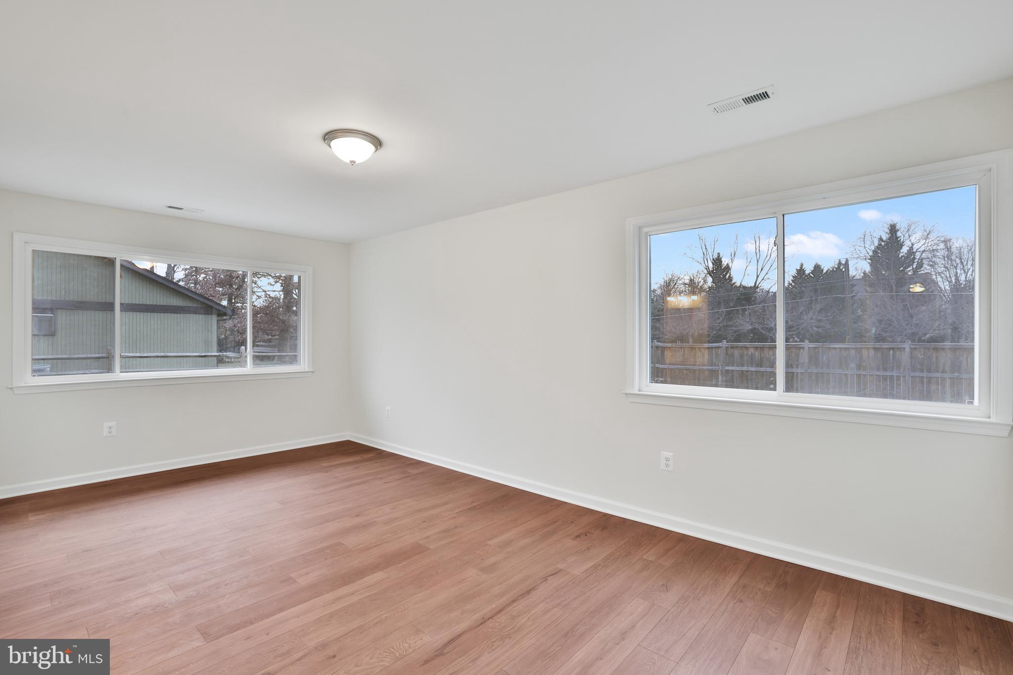 36 Thrush Road Sterling, VA 20164 - Photo 30 of 35 a view of an empty room with wooden floor and a window
