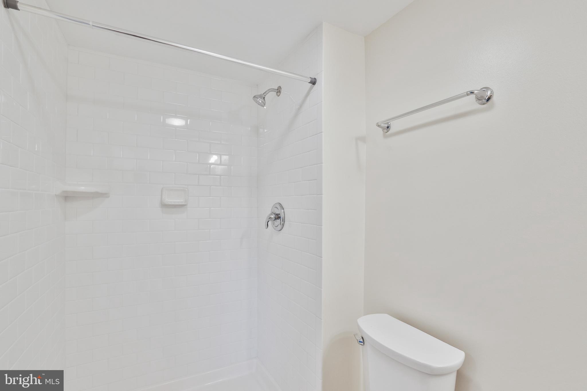 36 Thrush Road Sterling, VA 20164 - Photo 33 of 35 a bathroom with a shower and toilet