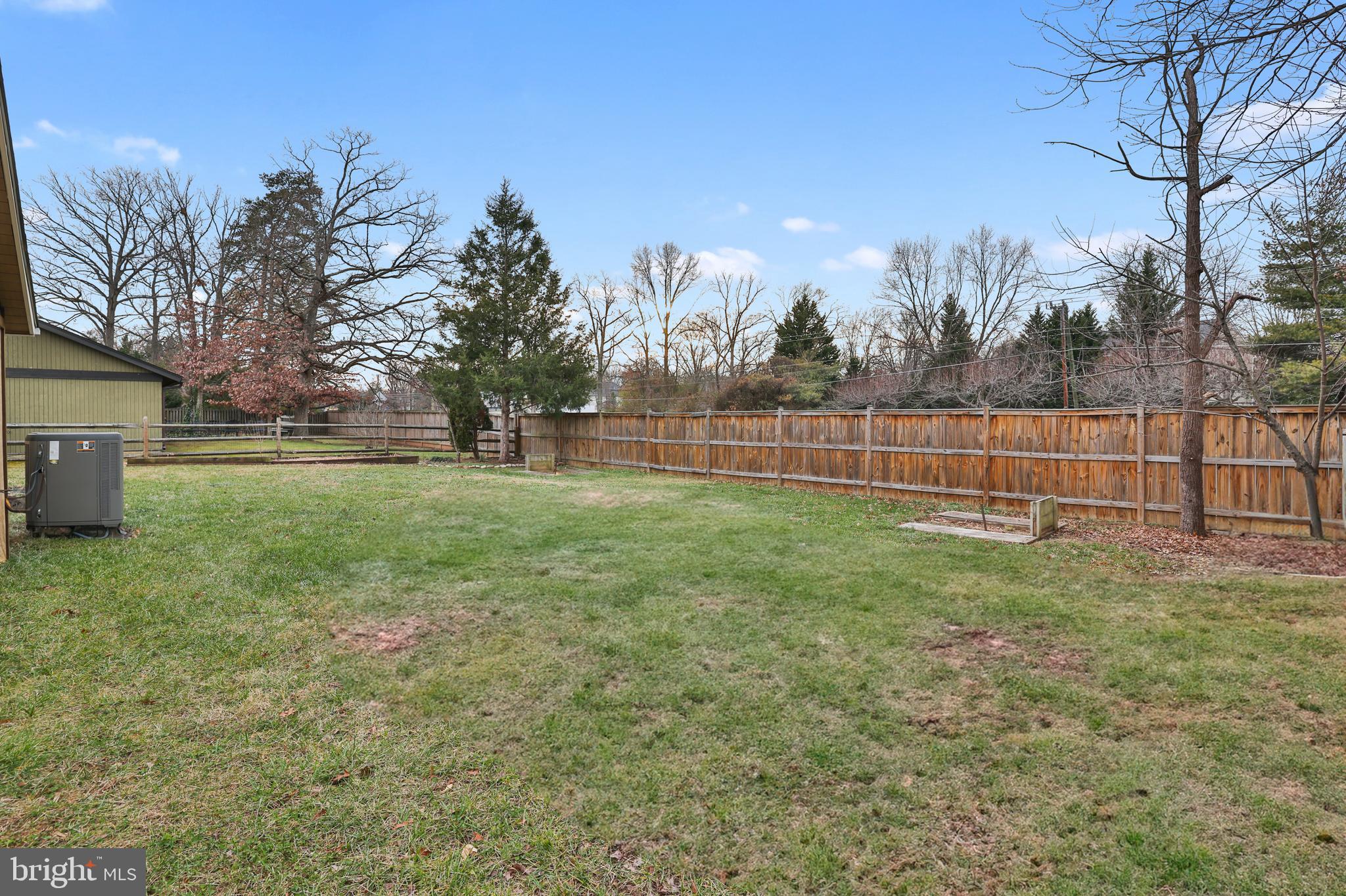 36 Thrush Road Sterling, VA 20164 - Photo 10 of 35 a view of a yard with a house and large trees