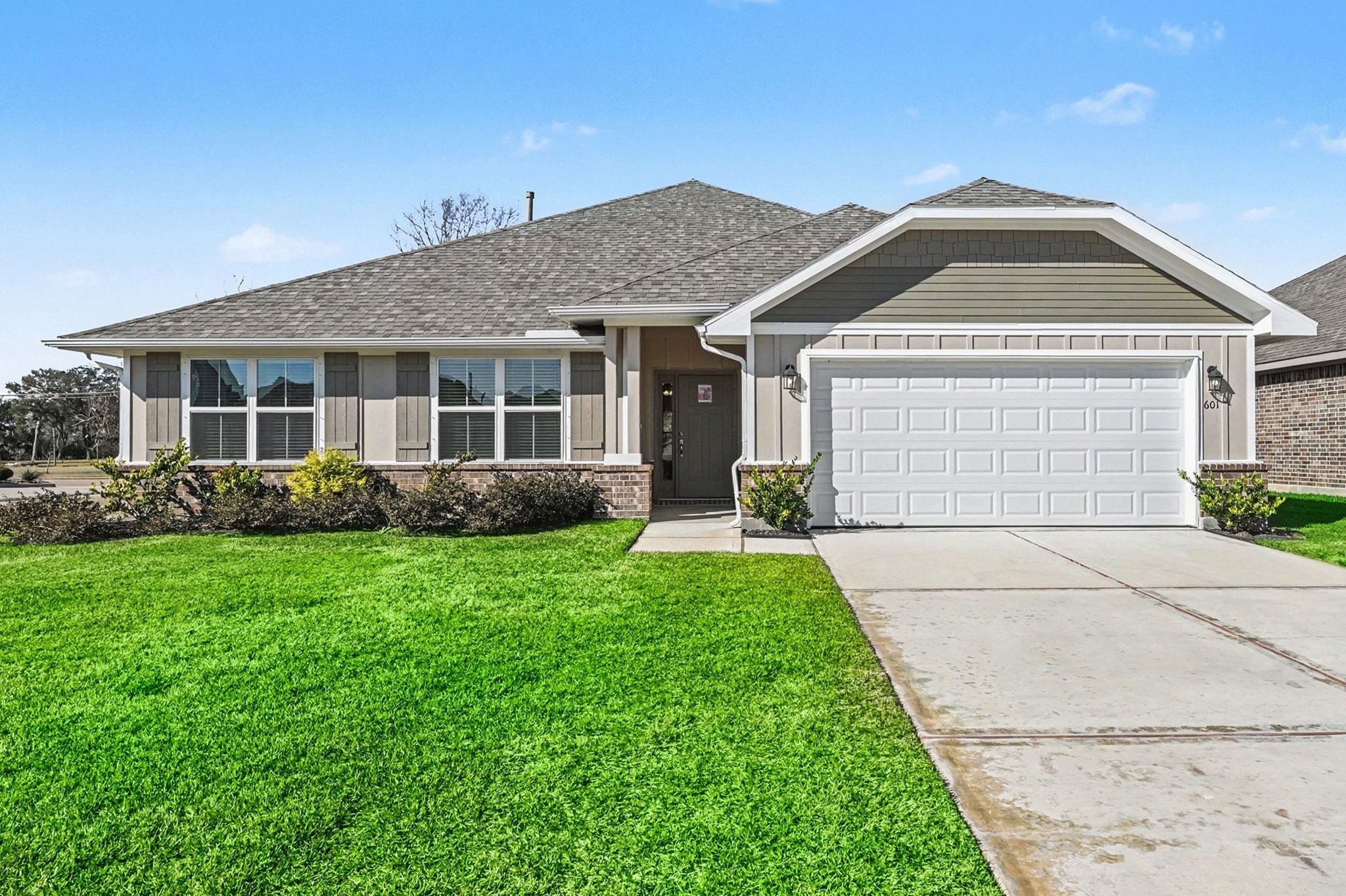601 Greystone Lane Angleton, TX 77515 - Photo 2 of 32 front view of a house with a yard