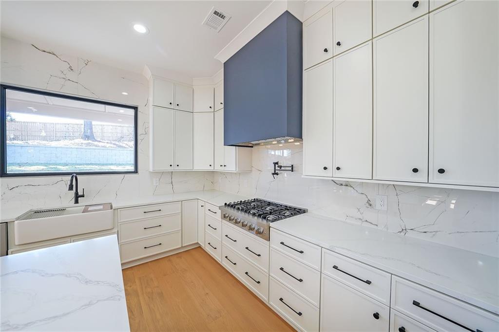 156 Rocky Ridge Way Auburn, GA 30011 - Photo 12 of 56 a kitchen with granite countertop a sink and cabinets