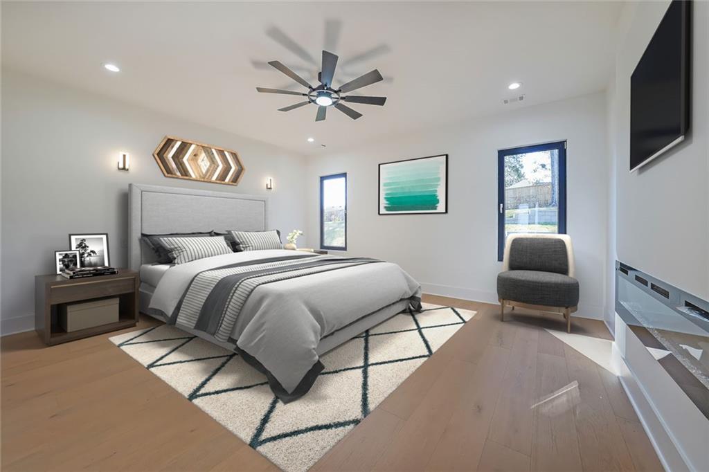 156 Rocky Ridge Way Auburn, GA 30011 - Photo 19 of 56 a bedroom with a bed and a chandelier