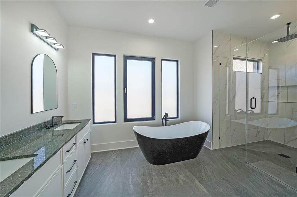 156 Rocky Ridge Way Auburn, GA 30011 - Photo 24 of 56 a large spacious bathroom with a double vanity sink and a bathtub
