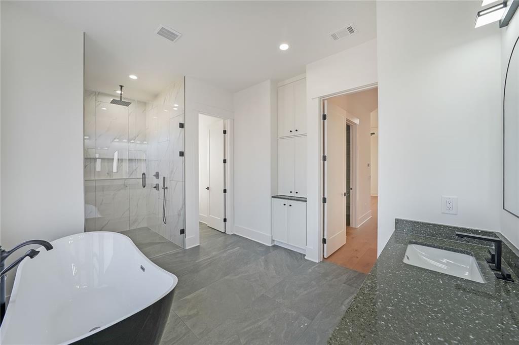 156 Rocky Ridge Way Auburn, GA 30011 - Photo 28 of 56 a bathroom with a sink a toilet and shower