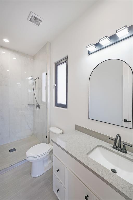 156 Rocky Ridge Way Auburn, GA 30011 - Photo 42 of 56 a bathroom with a granite countertop sink mirror vanity and toilet