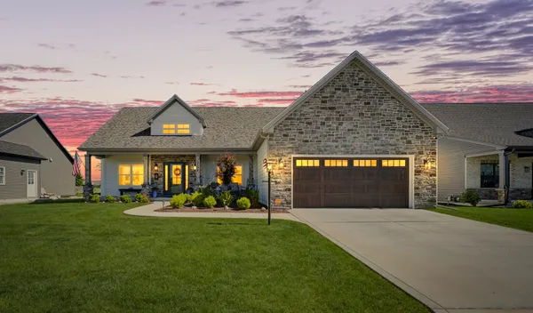 a view of a house with a yard