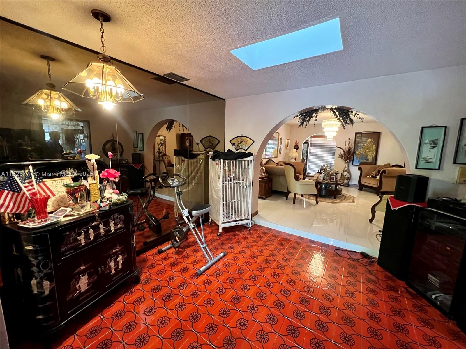 9601 Southwest 66th Street Miami, FL 33173 - Photo 12 of 52 a room with lots of gym equipment