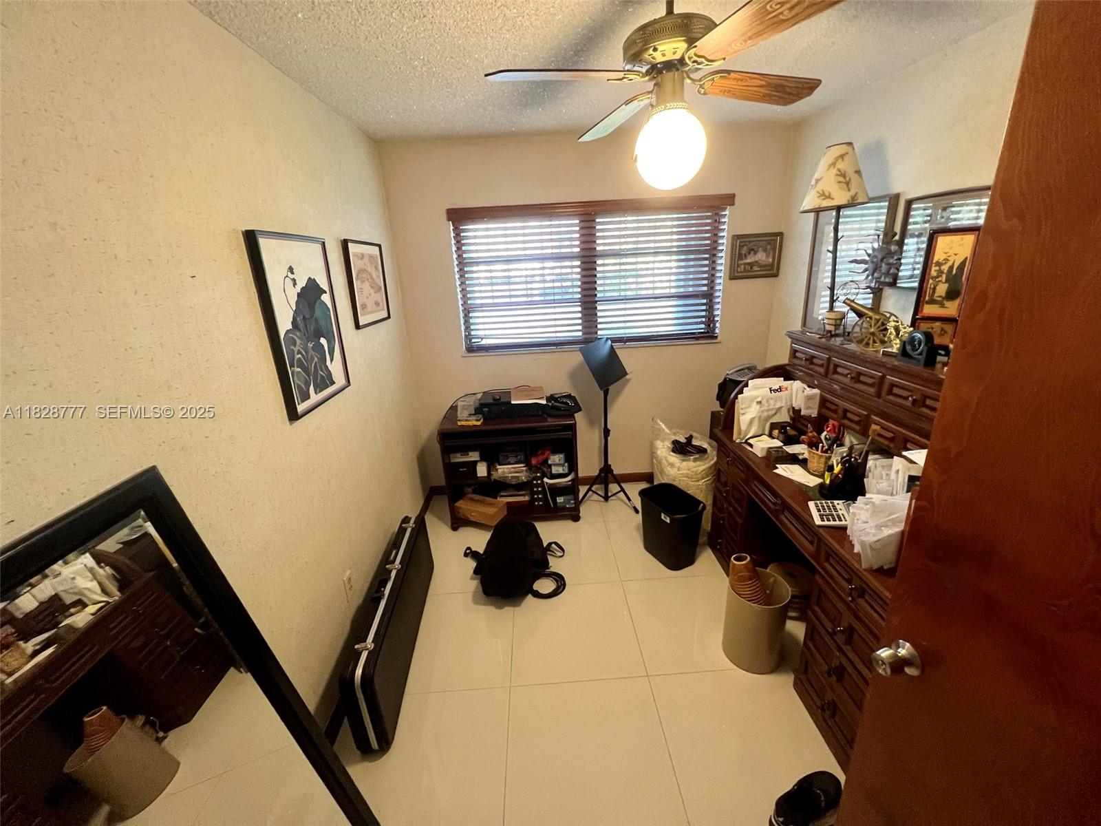 9601 Southwest 66th Street Miami, FL 33173 - Photo 18 of 52 a picture of a livingroom with furniture and a window