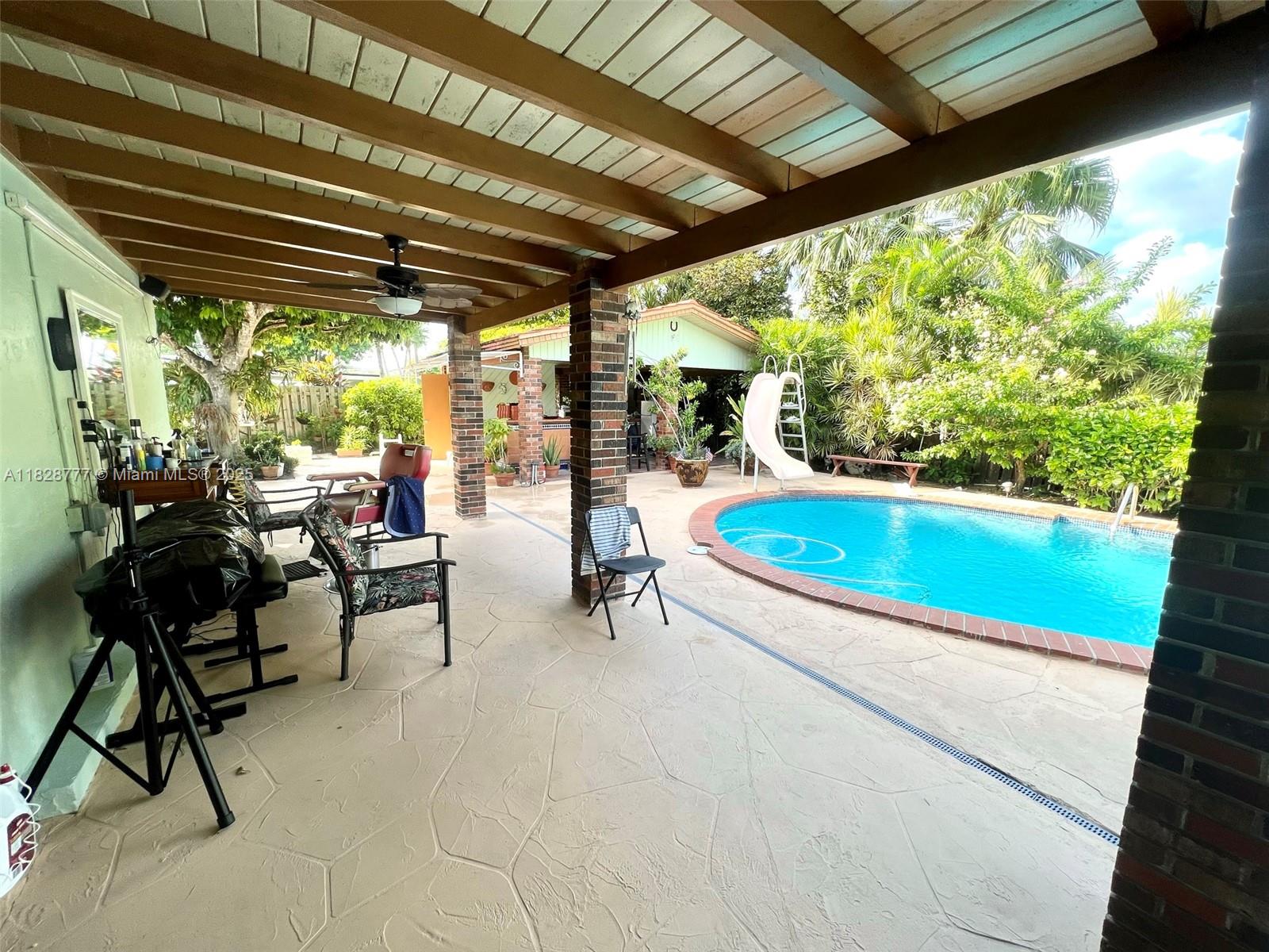 9601 Southwest 66th Street Miami, FL 33173 - Photo 27 of 52 a view of swimming pool with chairs