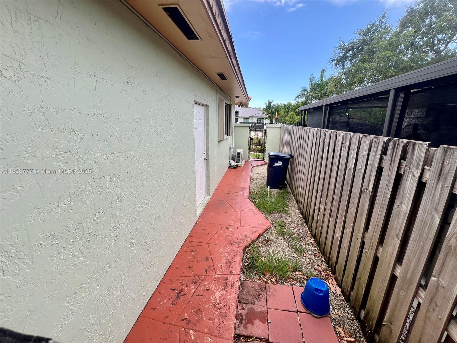 9601 Southwest 66th Street Miami, FL 33173 - Photo 31 of 52 a view of a backyard with wooden fence