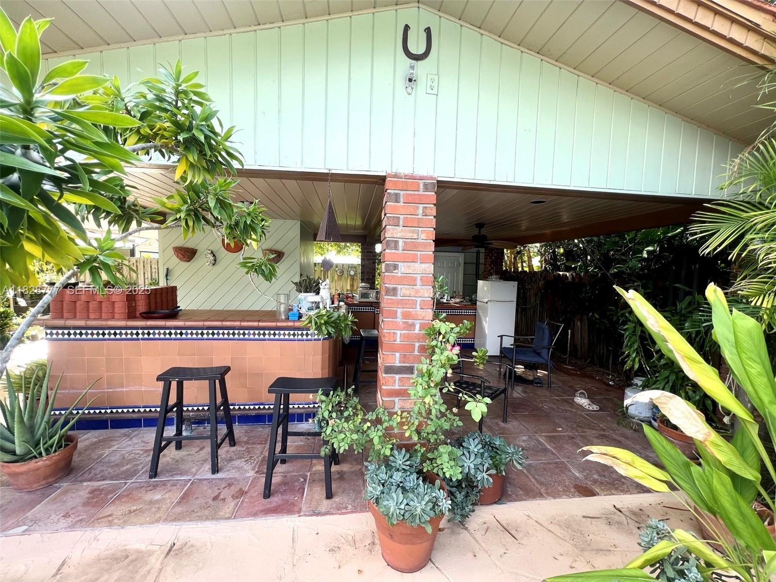 9601 Southwest 66th Street Miami, FL 33173 - Photo 44 of 52 a view of a chairs and table in patio