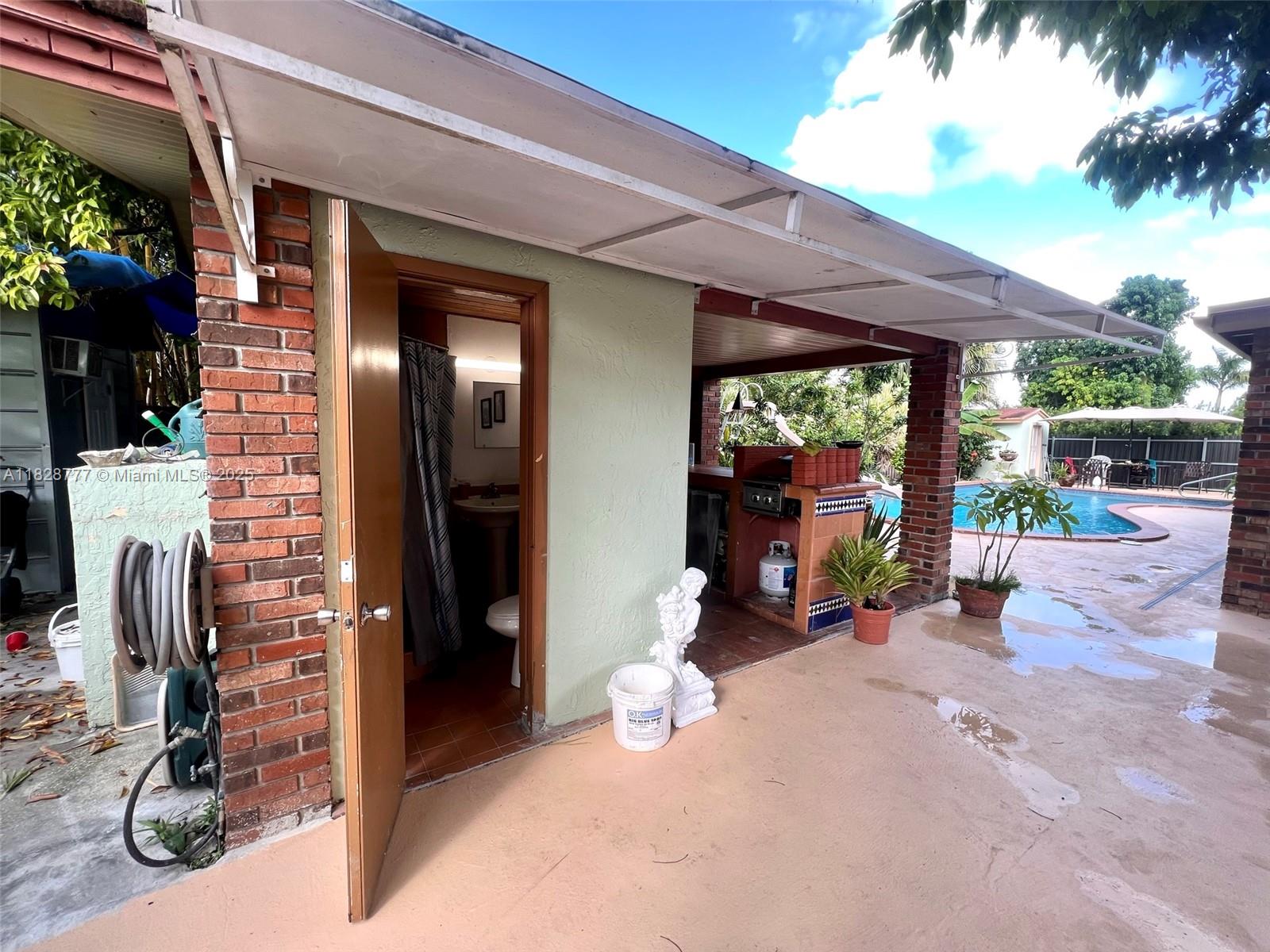 9601 Southwest 66th Street Miami, FL 33173 - Photo 47 of 52 a view of a room with gym equipment and a large window