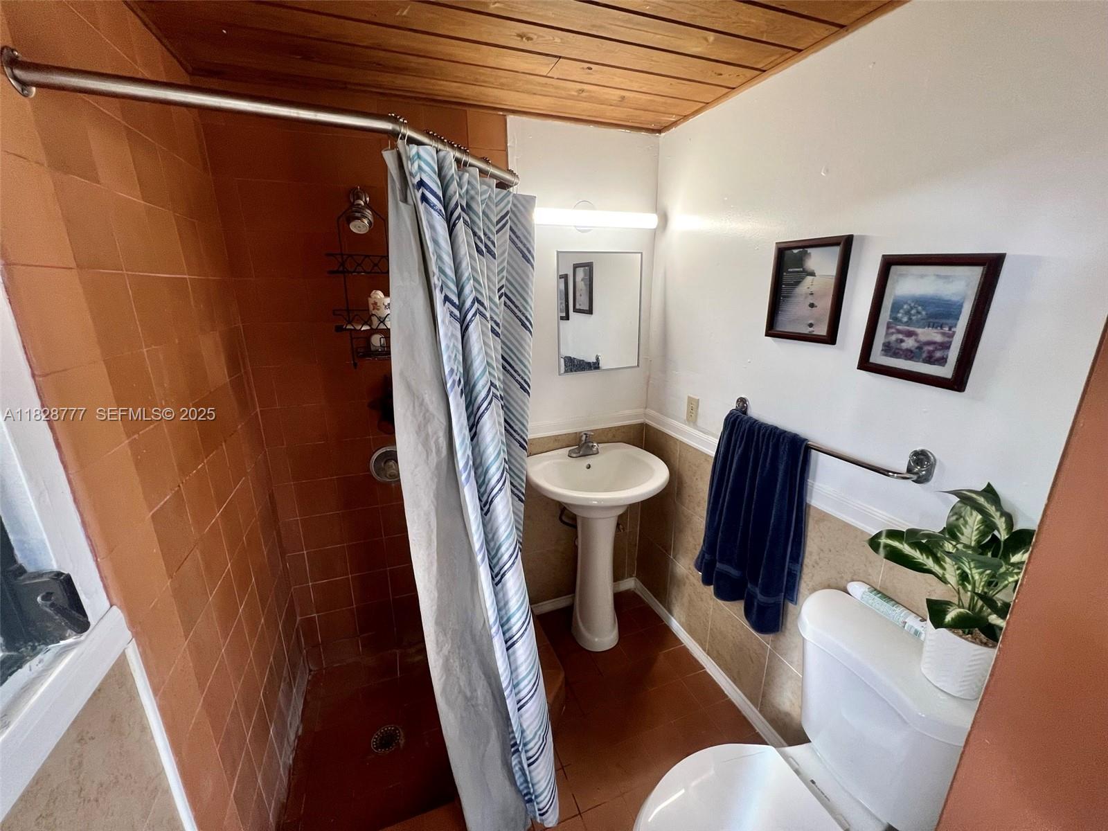 9601 Southwest 66th Street Miami, FL 33173 - Photo 48 of 52 a view of a hallway with furniture and wooden floor