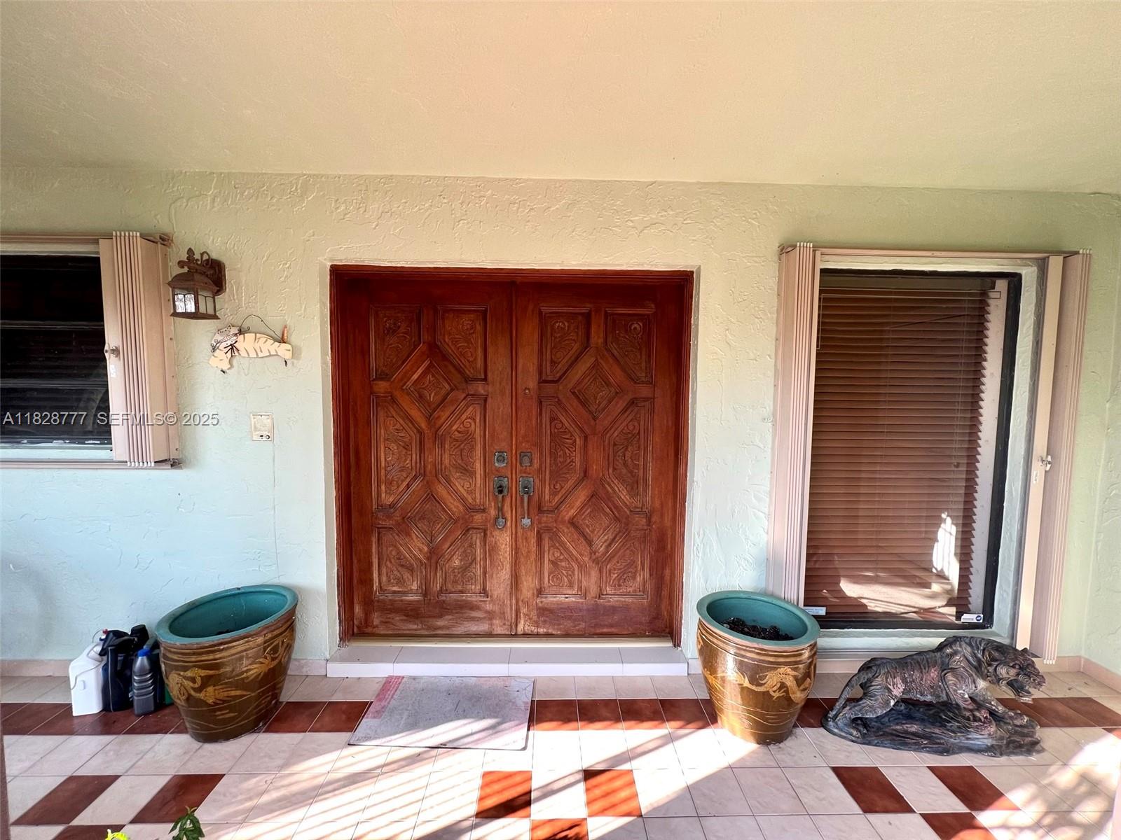9601 Southwest 66th Street Miami, FL 33173 - Photo 5 of 52 a living room with furniture and a potted plant