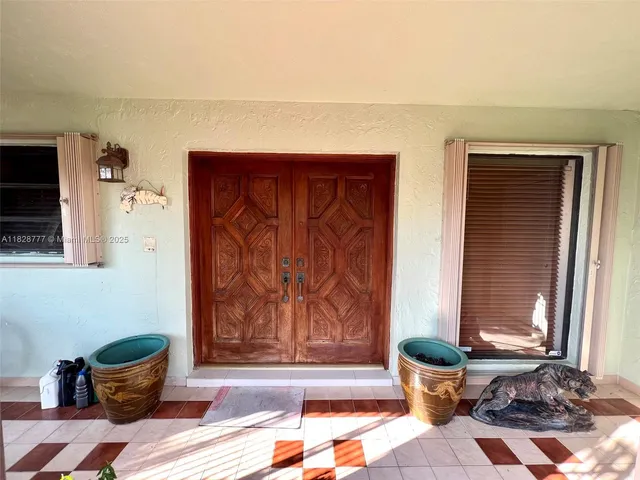 a view of a livingroom with furniture and a chandelier