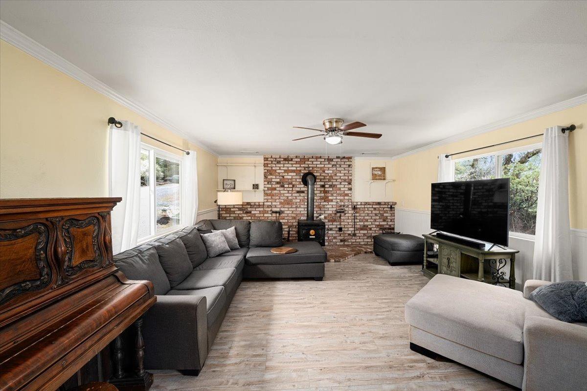 2227 Swansboro Road Placerville, CA 95667 - Photo 11 of 59 a living room with furniture and a flat screen tv