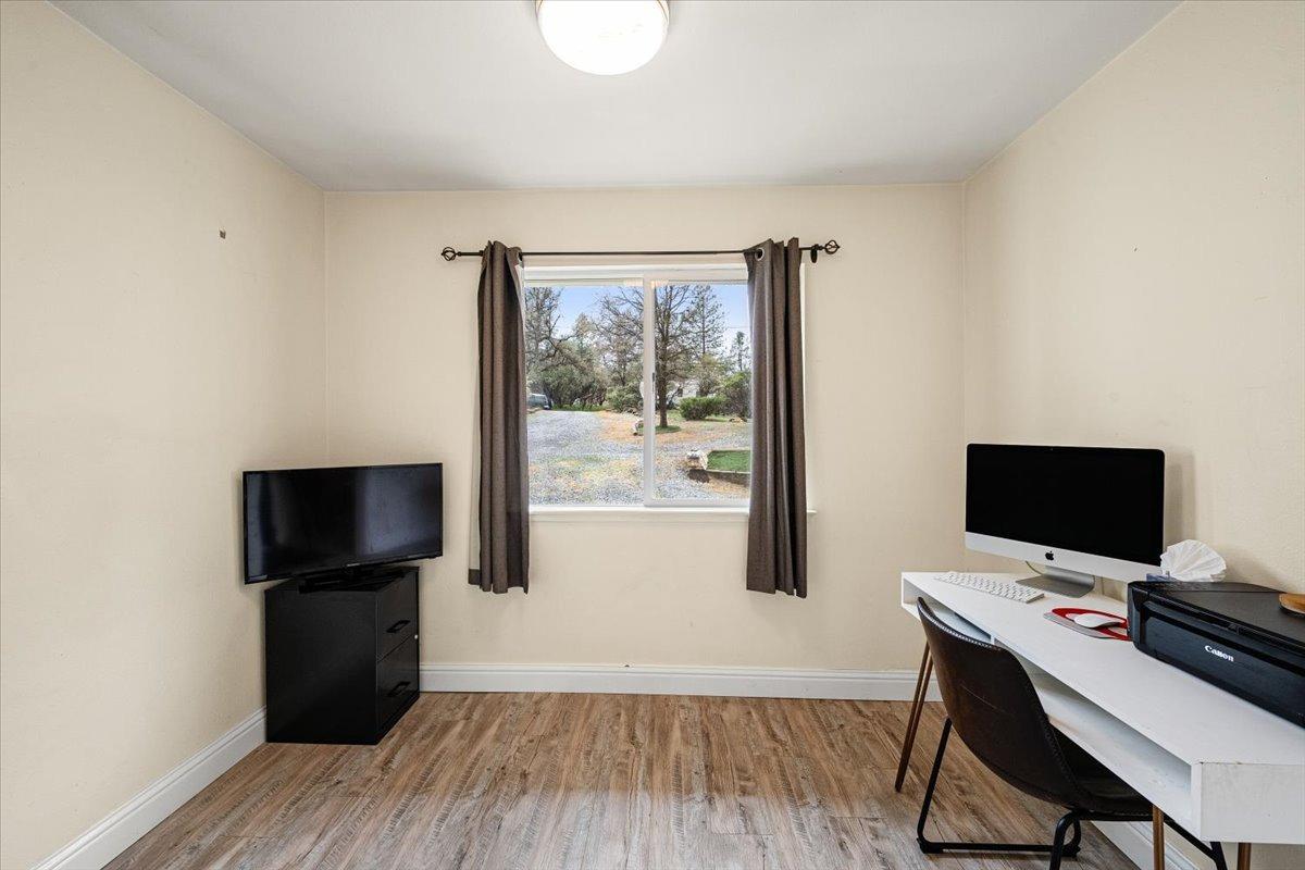 2227 Swansboro Road Placerville, CA 95667 - Photo 13 of 59 a view of a workspace with furniture and wooden floor