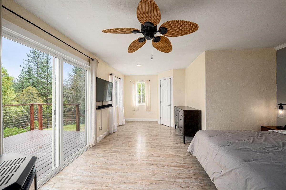 2227 Swansboro Road Placerville, CA 95667 - Photo 15 of 59 a view of a livingroom with a chandelier fan and windows