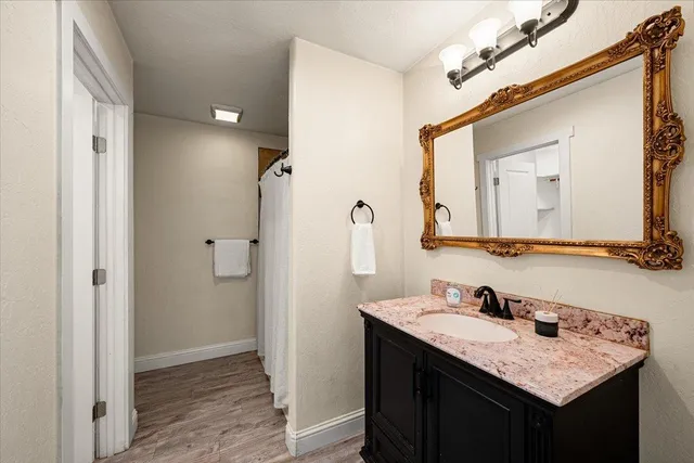 an aerial view of a house with swimming pool garden and lake view