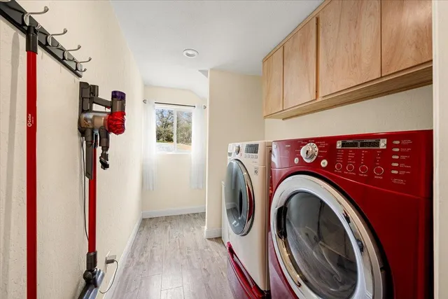 a view of a balcony with chairs and wooden floor