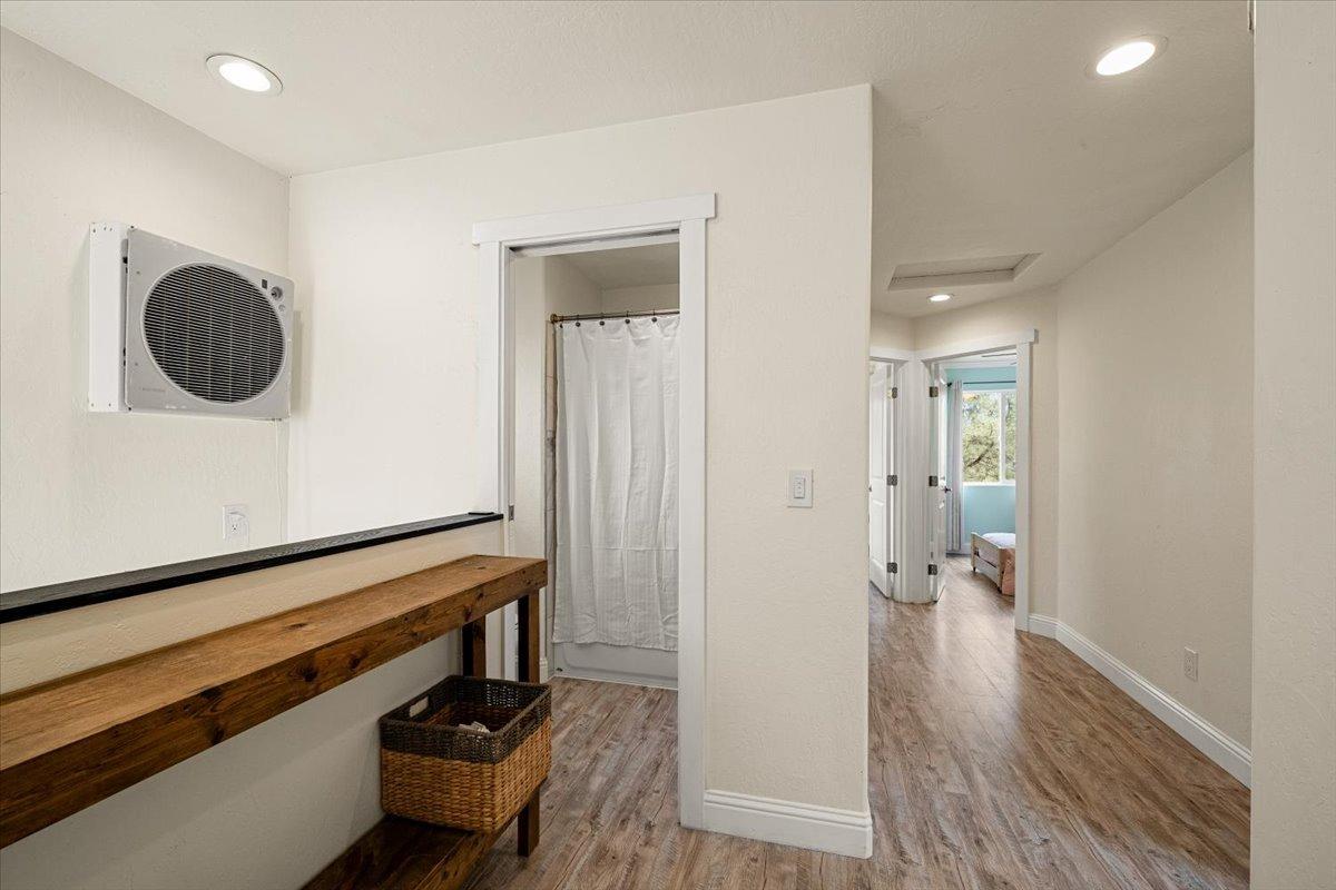2227 Swansboro Road Placerville, CA 95667 - Photo 20 of 59 a view of a hallway with wooden floor and staircase
