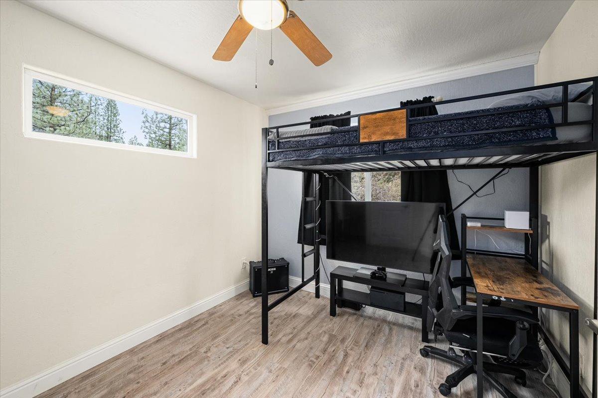 2227 Swansboro Road Placerville, CA 95667 - Photo 22 of 59 a room with stainless steel appliances wooden floor and a window