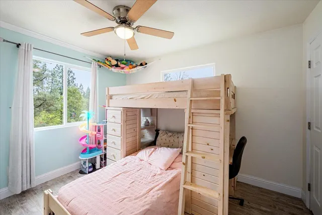 a view of a house with pool and a yard