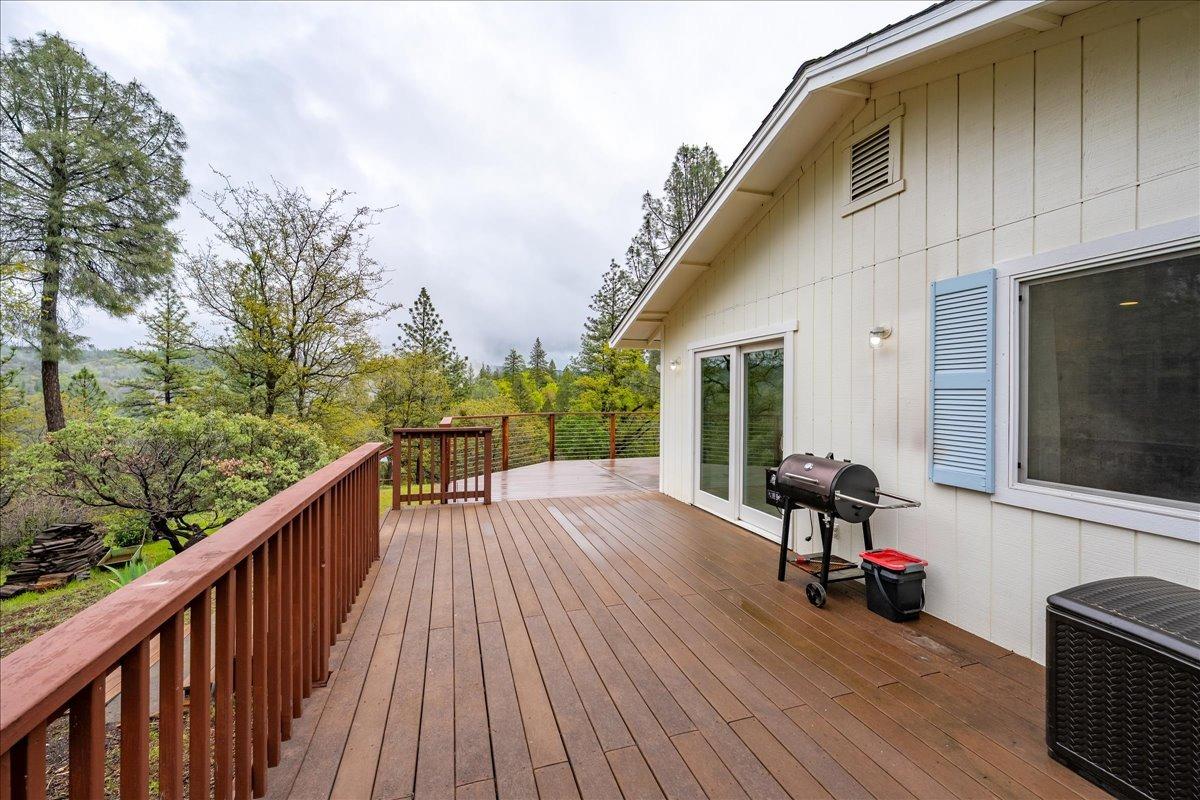 2227 Swansboro Road Placerville, CA 95667 - Photo 34 of 59 a view of a balcony with chairs and wooden floor