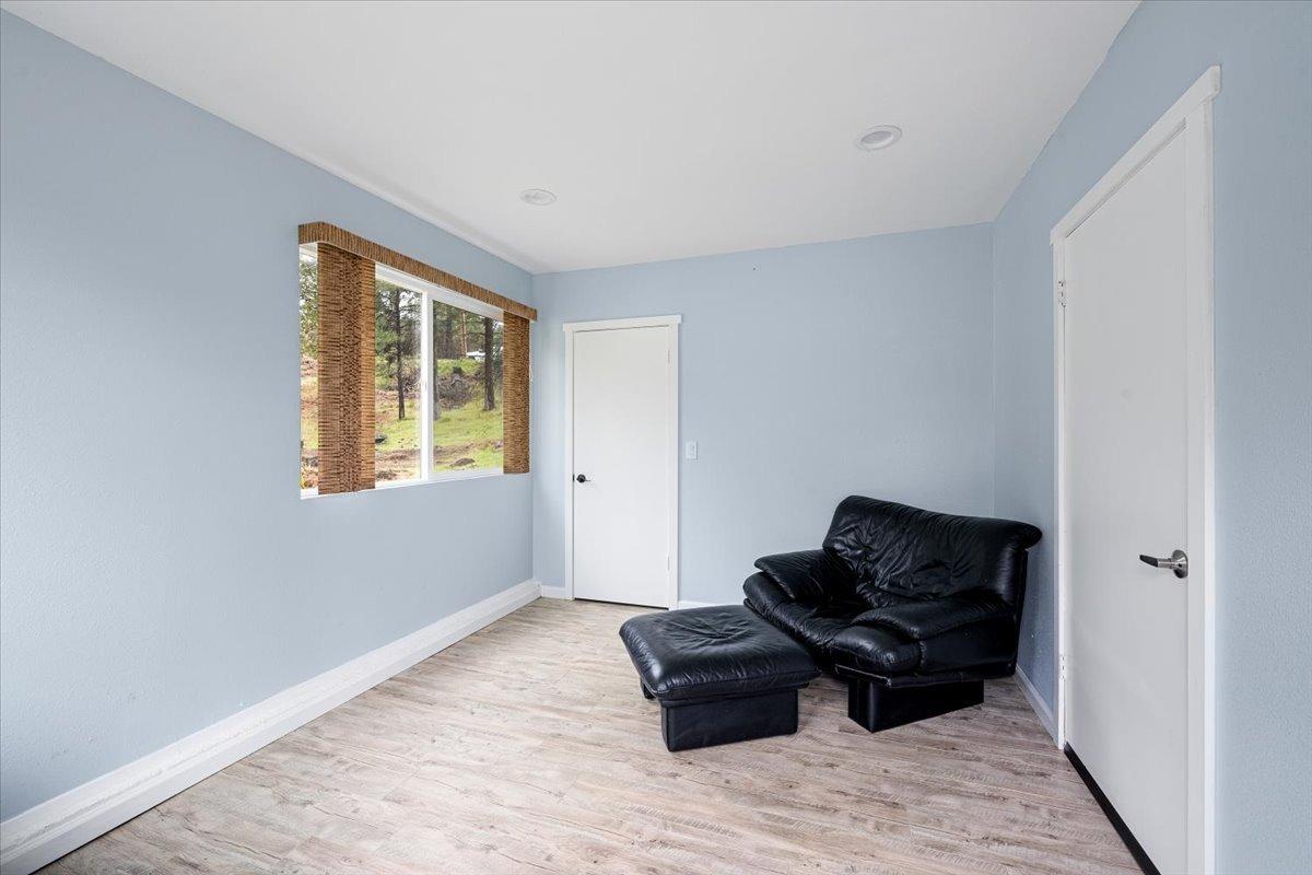 2227 Swansboro Road Placerville, CA 95667 - Photo 46 of 59 a living room with furniture rug and a window