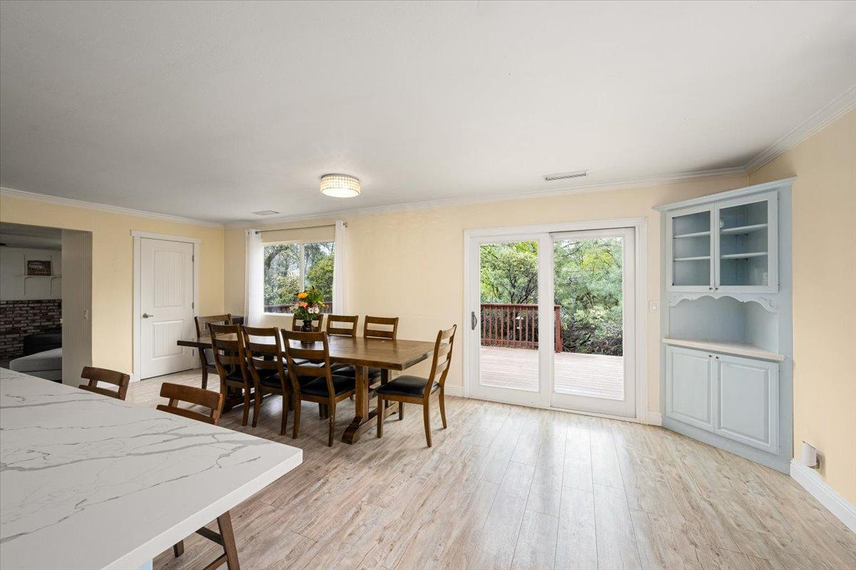 2227 Swansboro Road Placerville, CA 95667 - Photo 8 of 59 a view of a dining room with furniture and wooden floor