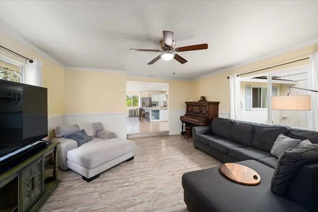 a view of walk in closet with clothes