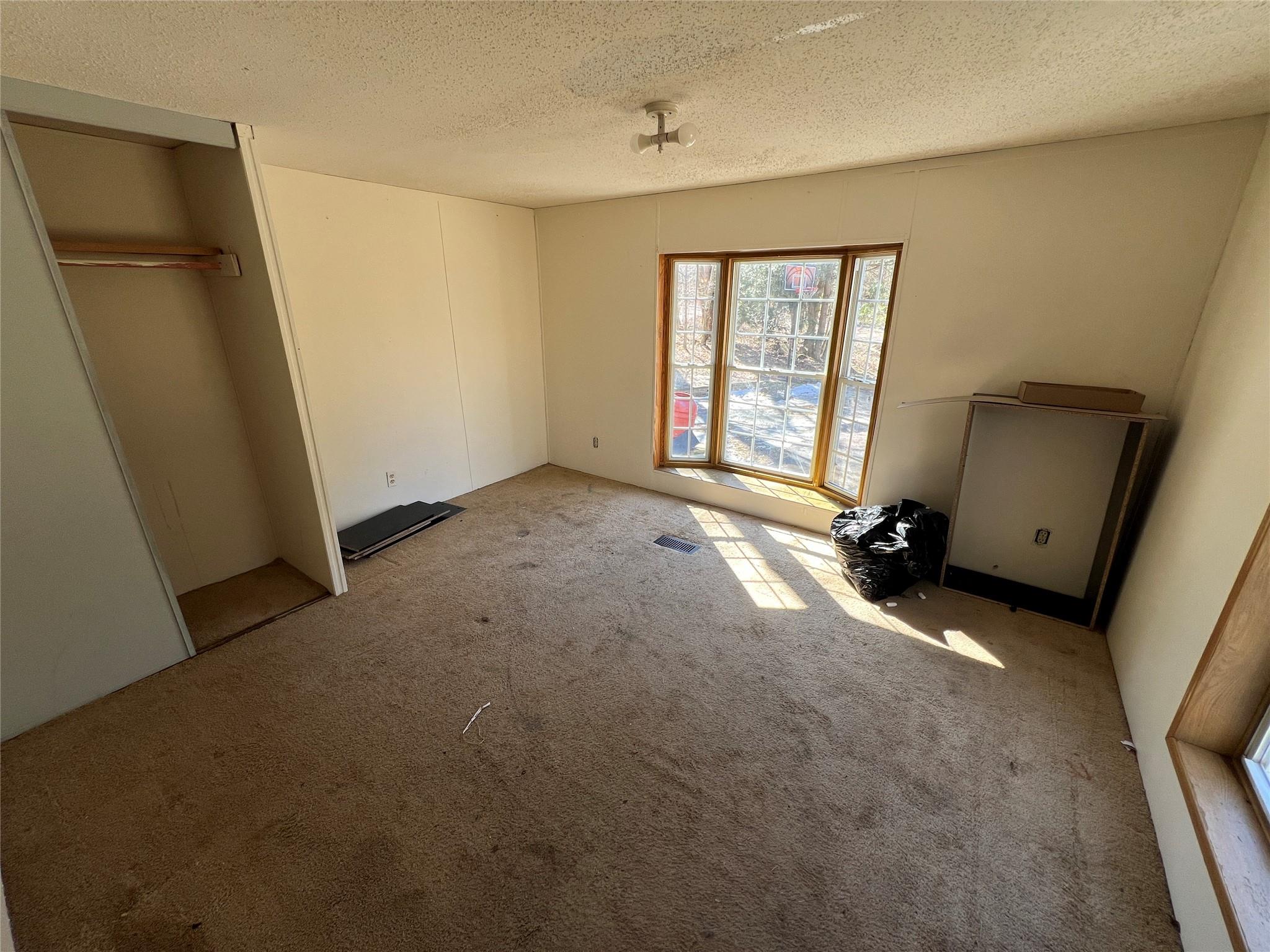 734 Shaver Hollow Road Andes, NY 13731 - Photo 9 of 9 Unfurnished bedroom featuring a textured ceiling and carpet floors