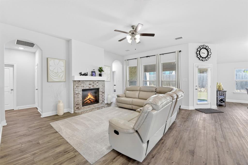 136 Gleeson Drive Red Oak, TX 75154 - Photo 22 of 40 a living room with furniture and a fireplace