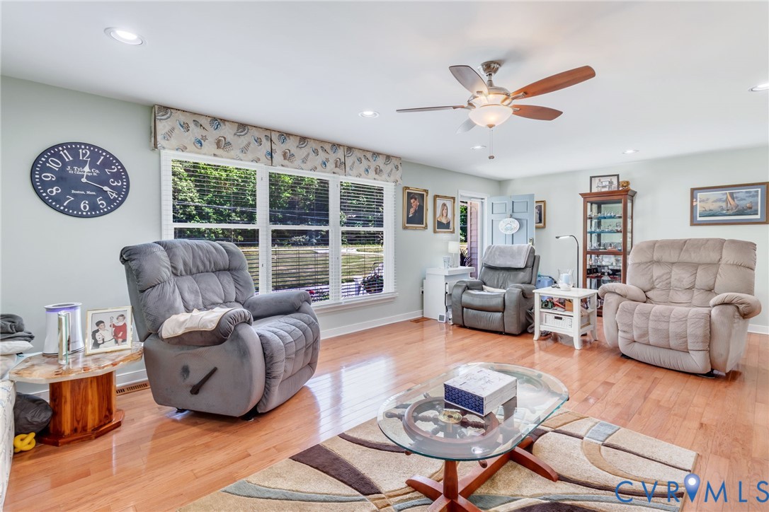 4400 Hacks Neck Road Heathsville, VA 22473 - Photo 12 of 78 a living room with furniture and a large window