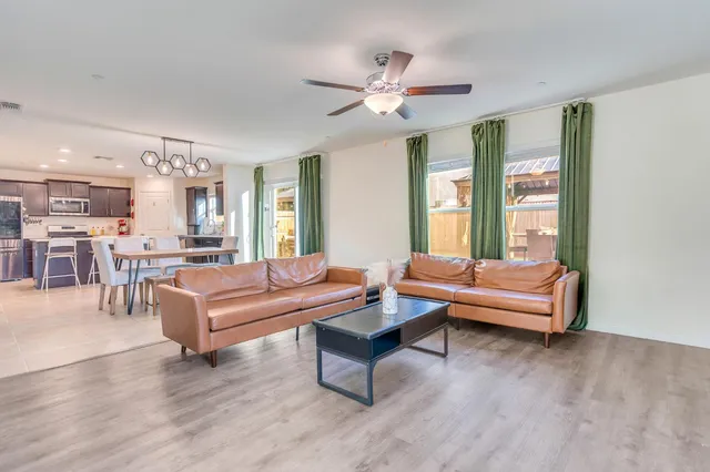 a kitchen with stainless steel appliances granite countertop a sink and a stove