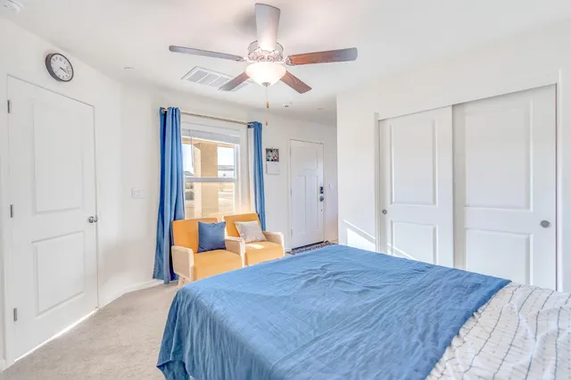 a bedroom with a bed and a shower