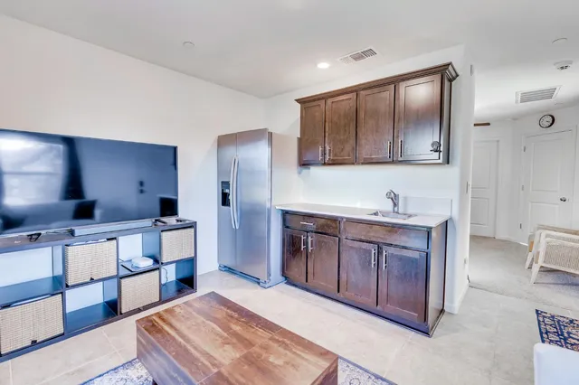 a bedroom with a bed and chair