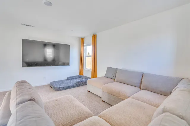 a view of a house with backyard and porch