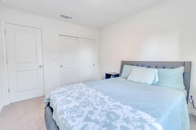 a view of an house with backyard porch and sitting area