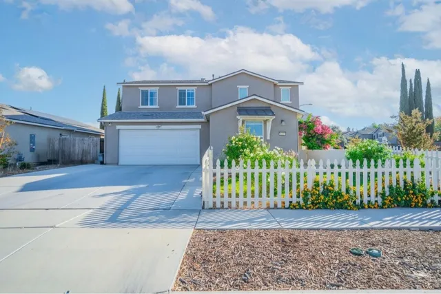 a view of a wrought iron fences in front of house
