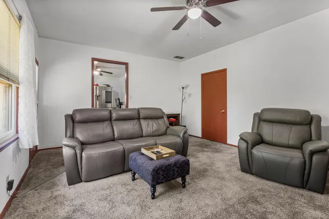 a living room with furniture and a rug