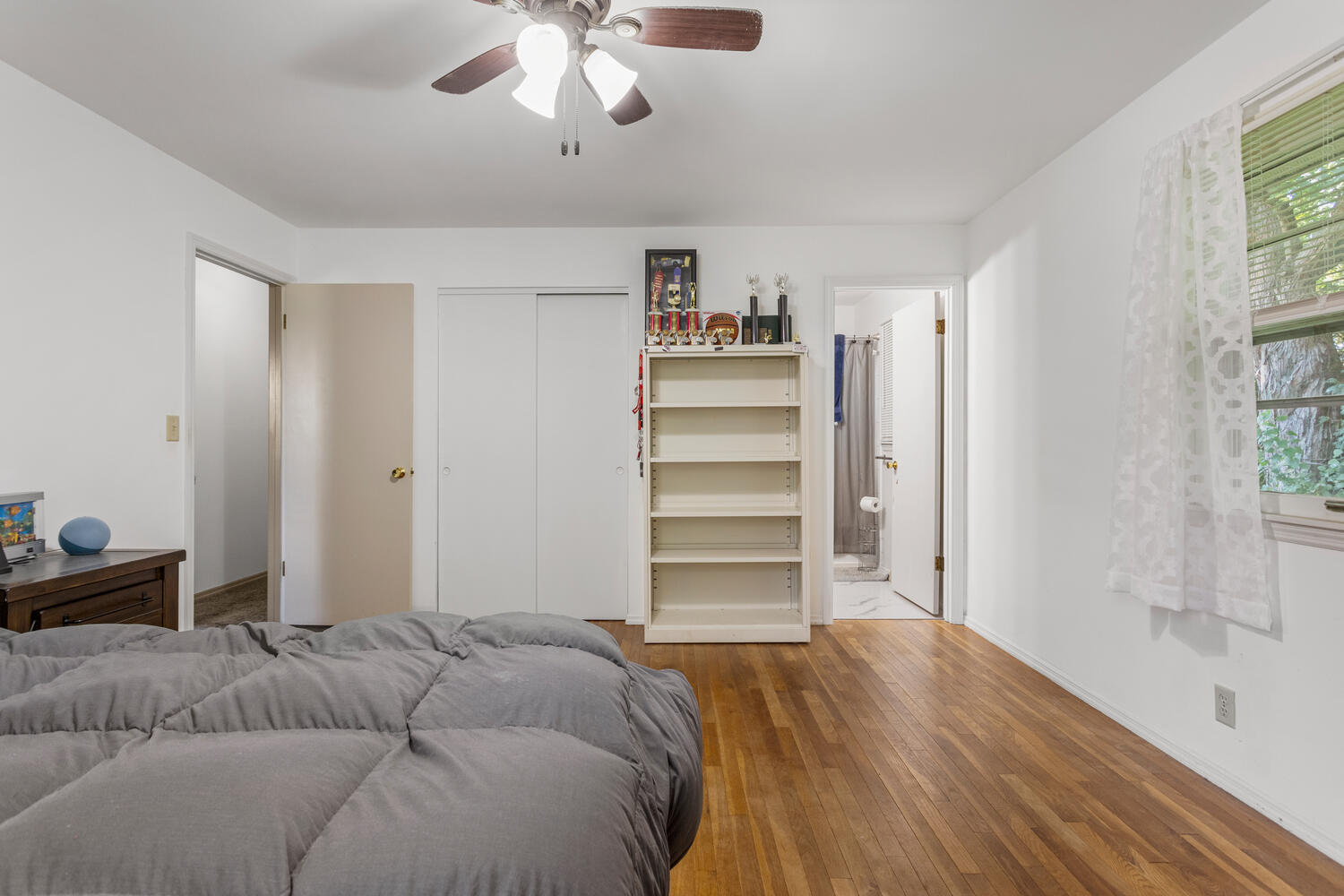 2305 East Shurts Circle Urbana, IL 61801 - Photo 15 of 26 a living room with a bed furniture and a window
