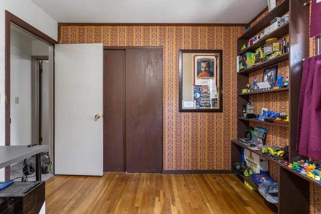a view of room with toys and wooden floor