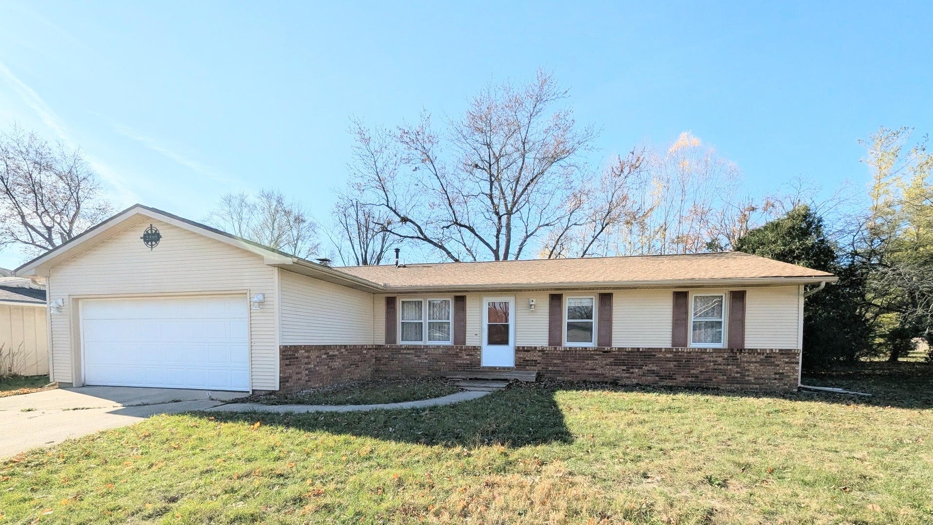 2305 East Shurts Circle Urbana, IL 61801 - Photo 2 of 26 a front view of a house with a yard