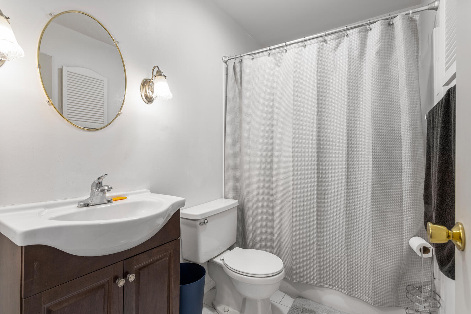 2305 East Shurts Circle Urbana, IL 61801 - Photo 21 of 26 a bathroom with a sink a toilet and a mirror