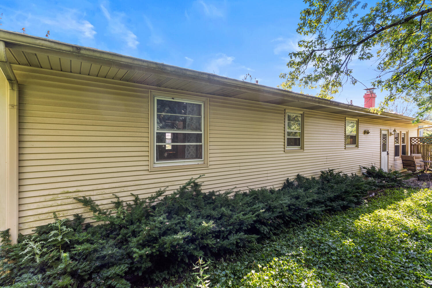 2305 East Shurts Circle Urbana, IL 61801 - Photo 24 of 26 a view of a house with a yard and plants
